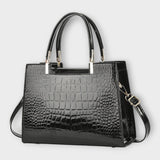 GLOSSY CROC-EMBOSSED HANDBAG