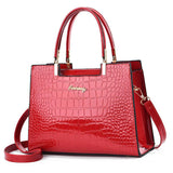 GLOSSY CROC-EMBOSSED HANDBAG